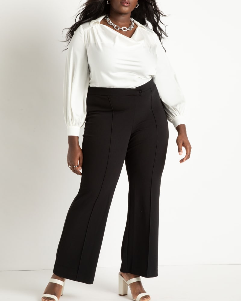 Front of a model wearing a size 14 Overlap Waist Flare Leg Pant in Black by ELOQUII. | dia_product_style_image_id:272926